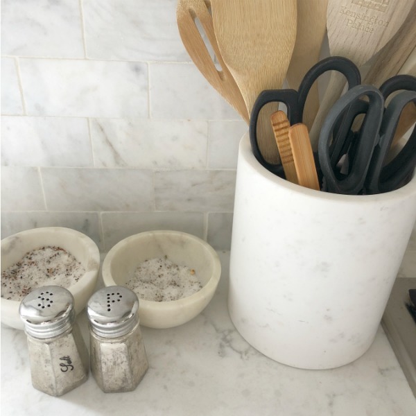 My simple white Shaker kitchen with white oak floors, marble subway backsplash, Viatera quartz "Minuet" counters, and a window seat. #hellolovelystudio #whiteshakerkitchen #kitchendesign #kitchendecor #classickitchen #viateraquartz #minuet