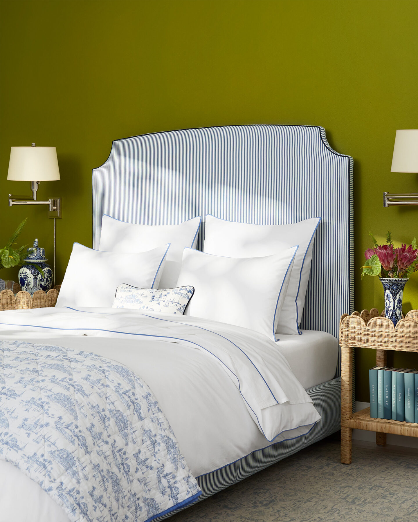 Charming coastal bedroom with French blue pinstripe bed and sophisticated chartreuse wall color.