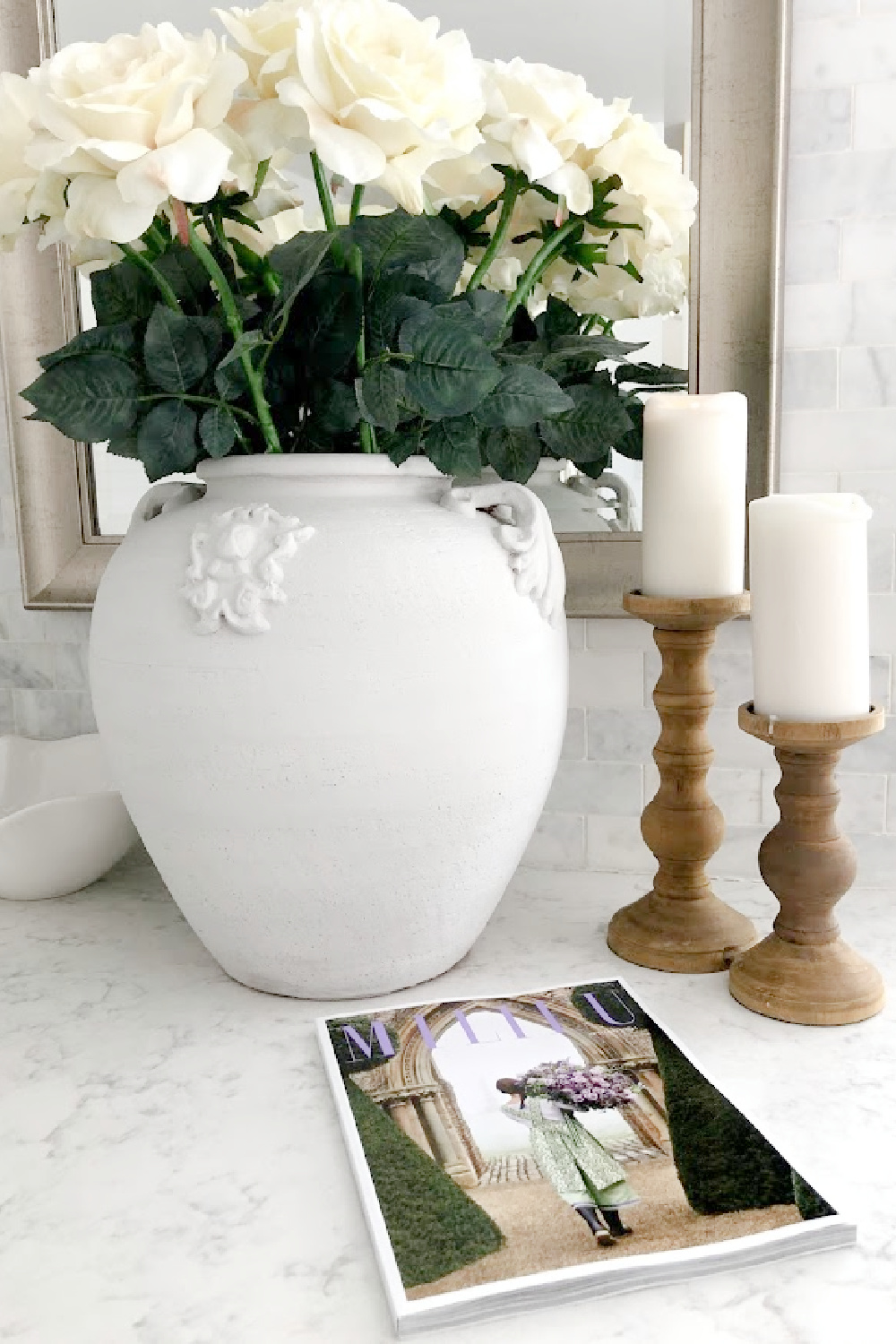 Milieu magazine (Spring 2021) on my kitchen counter (Viatera Minuet white quartz) with urn and candle holders - Hello Lovely Studio. #viateraquartz #minuet #milieu #modernfrench