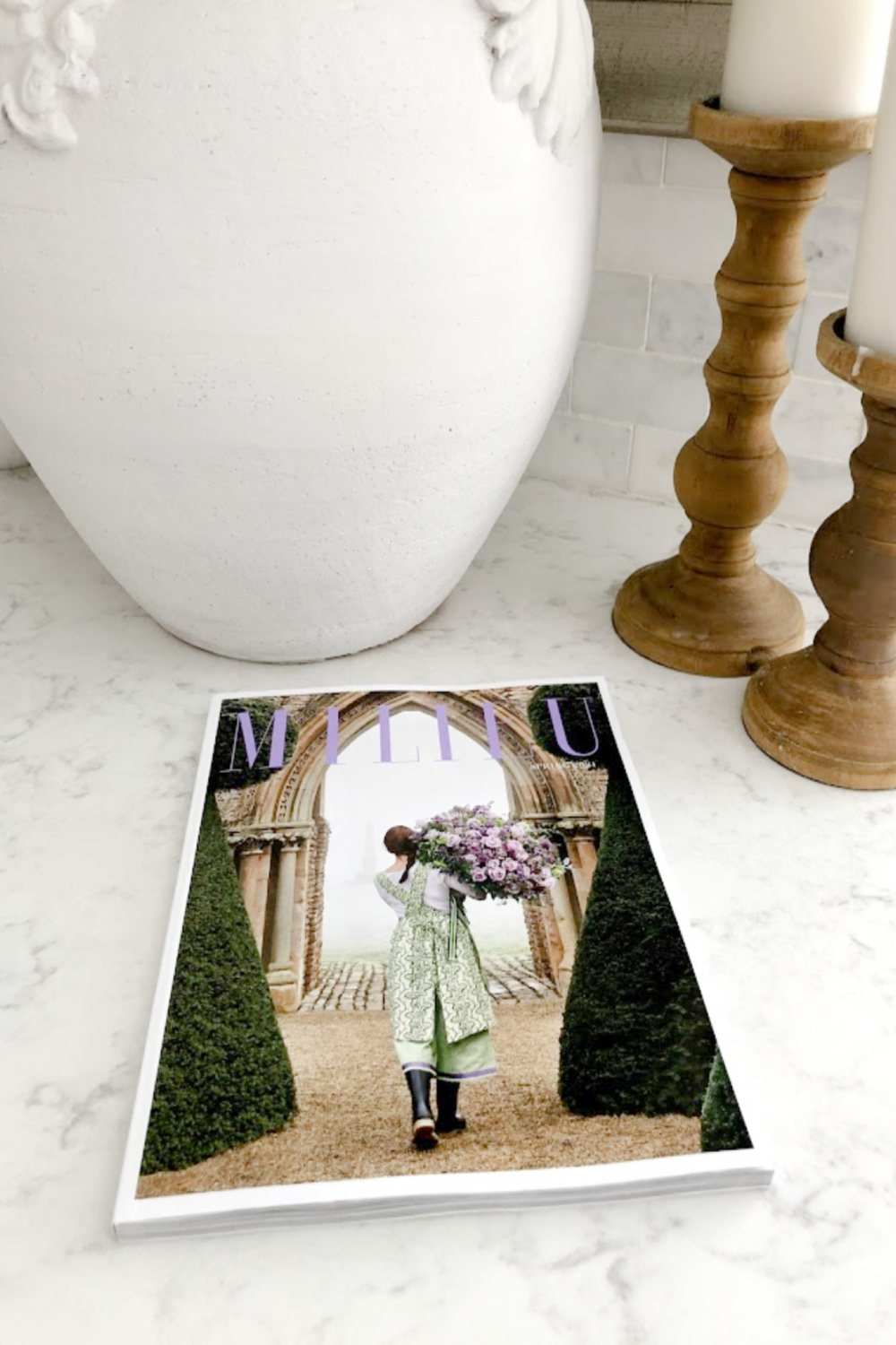 Milieu magazine (Spring 2021) on my kitchen counter (Viatera Minuet white quartz) with urn and candle holders - Hello Lovely Studio. #viateraquartz #minuet #milieu #modernfrench