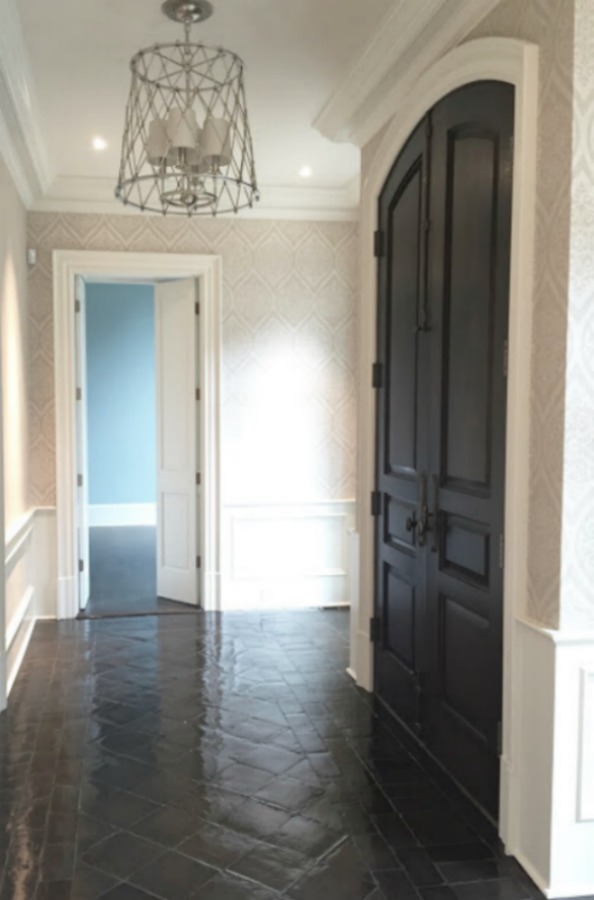 Dark stained terracotta tile floor in an entry - design by Sherry Hart. #entry #terracottatile #tilefloor #interiordesign