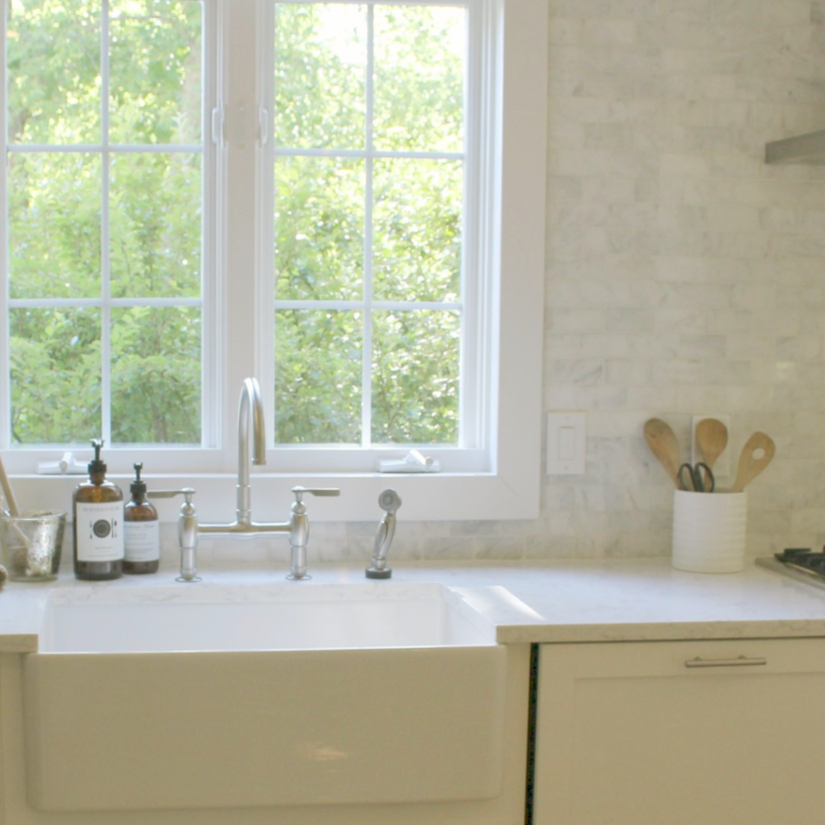 Apron front fireclay farm sink in our classic Shaker style kitchen with marble subway backsplash - Hello Lovely Studio. #farmsink #fireclay #shakerkitchen #hellolovelystudio #serenekitchen #kitchendesign