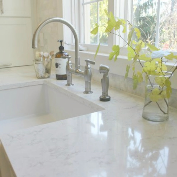 Apron front fireclay farm sink in our classic Shaker style kitchen with marble subway backsplash - Hello Lovely Studio. #farmsink #fireclay #shakerkitchen #hellolovelystudio #serenekitchen #kitchendesign