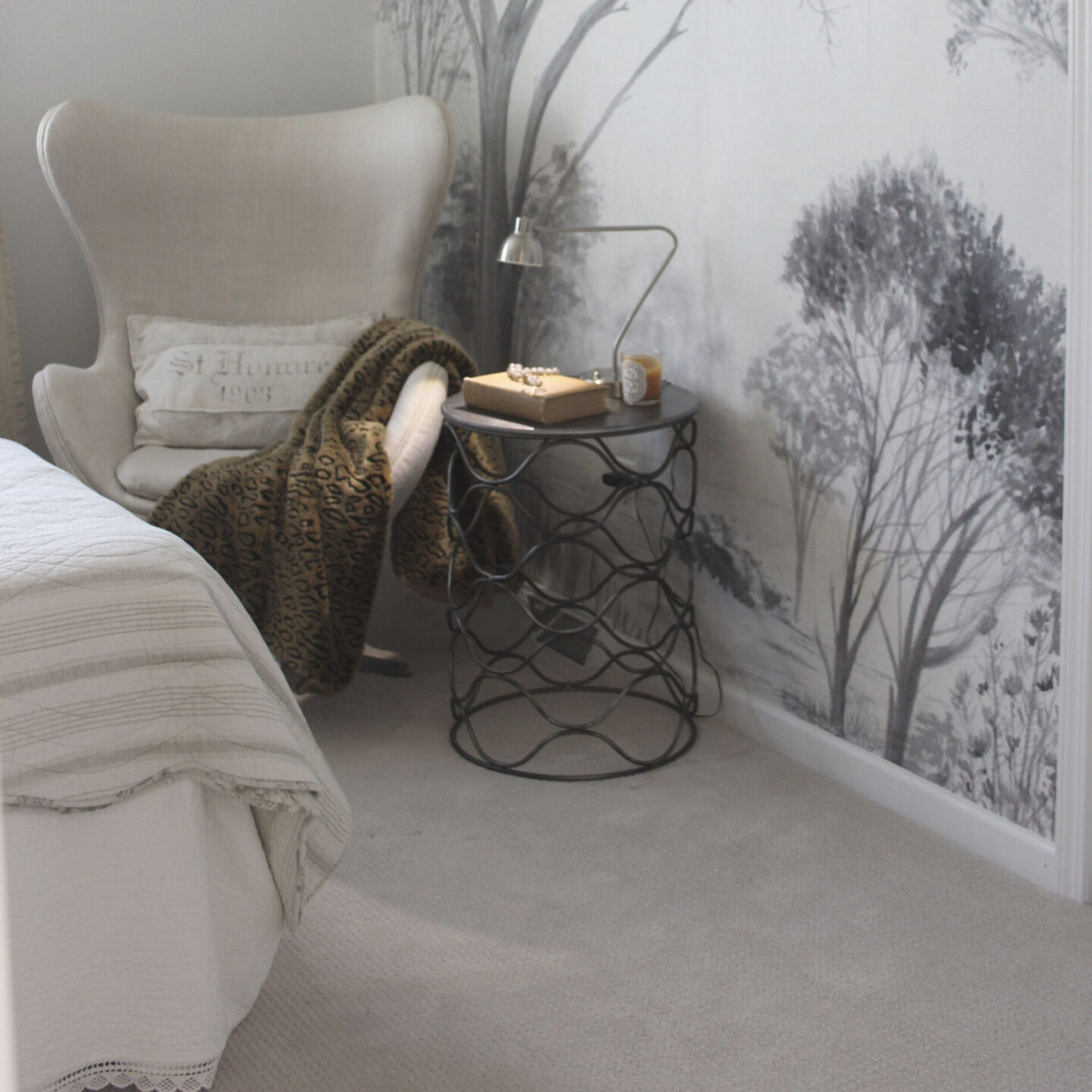 Lovely grisaille mural wallpaper from Photowall with grey trees on a white ground. I created a DIY accent wall in a guest bedroom, and the mood is timeless, serene and tranquil - Hello Lovely Studio. #wallpaper #mural #interiordesign #hellolovelystudio #grisaille #treewallpaper