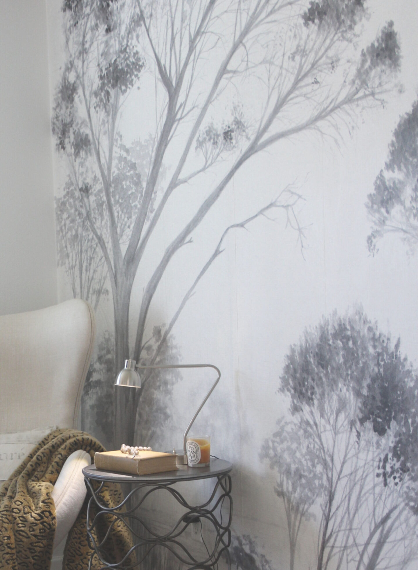 Subdued, understated, and serene, a tone on tone wall covering with gray trees sets a calm tone in a bedroom - Hello Lovely Studio. #wallcovering #photowall #treewallpaper #hellolovelystudio