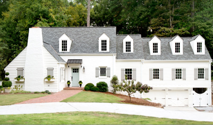 Beautiful white brick cottage painted Sherwin Williams Alabaster - Huff Harrington, Ladisic. #whitecottage #sherwinwilliamsalabaster #houseexterior #paintcolors