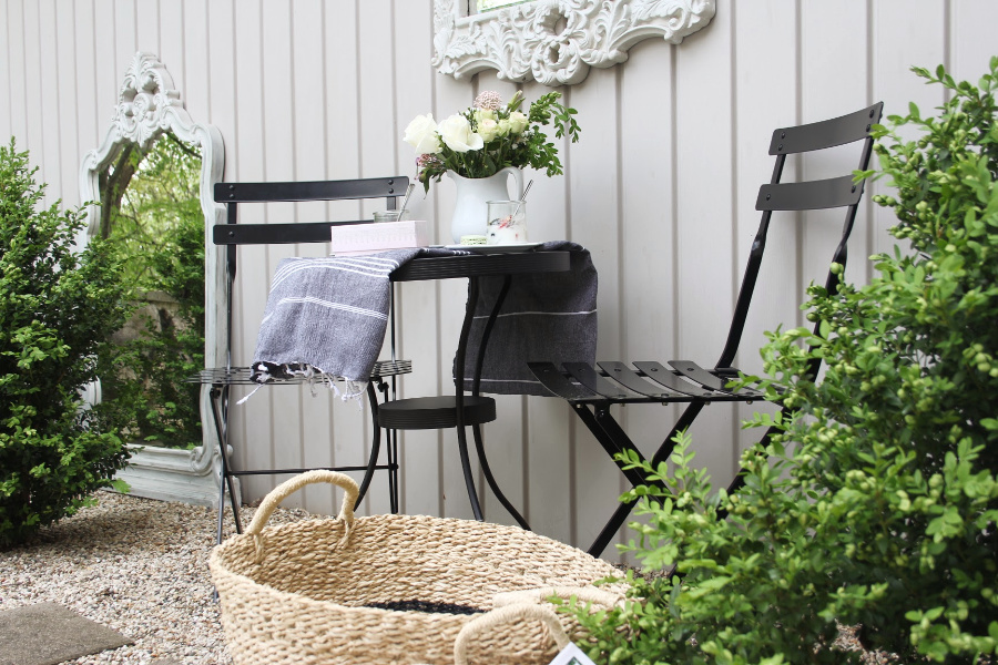 Parisian Café Chairs and baskets to stow summer essentials inside and out. #cafechairs #bistrochairs #frenchcountry #outdoorfurniture #seagrassbaskets #frenchbaskets #homedecor #modernfrench #hellolovelystudio