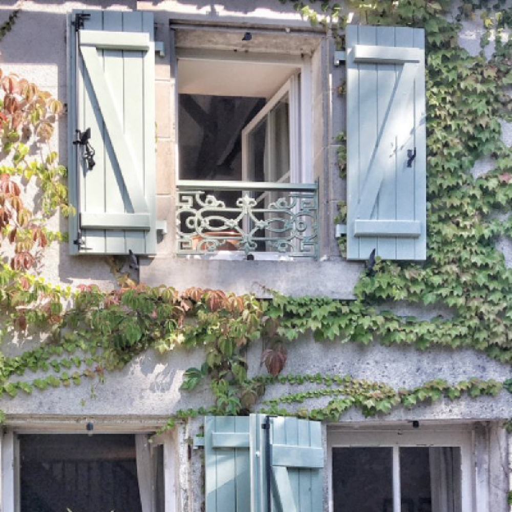 Climbing vines and green shutters on an authentic French farmhouse by Vivi et Margot. #frenchfarmhouse #exterior #vivietmargot #greenshutters #frenchcountry #rusticdecor #farmhouse #provence #southoffrance