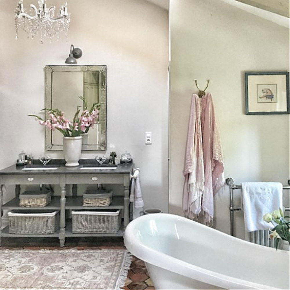 Rustic elegant bathroom in France.  You'll love this photo gallery and house tour of a home near Bordeaux, France. #vivietmargot #frenchfarmhouse #rusticdecor #countryfrench #interiordesign #bathroomdecor