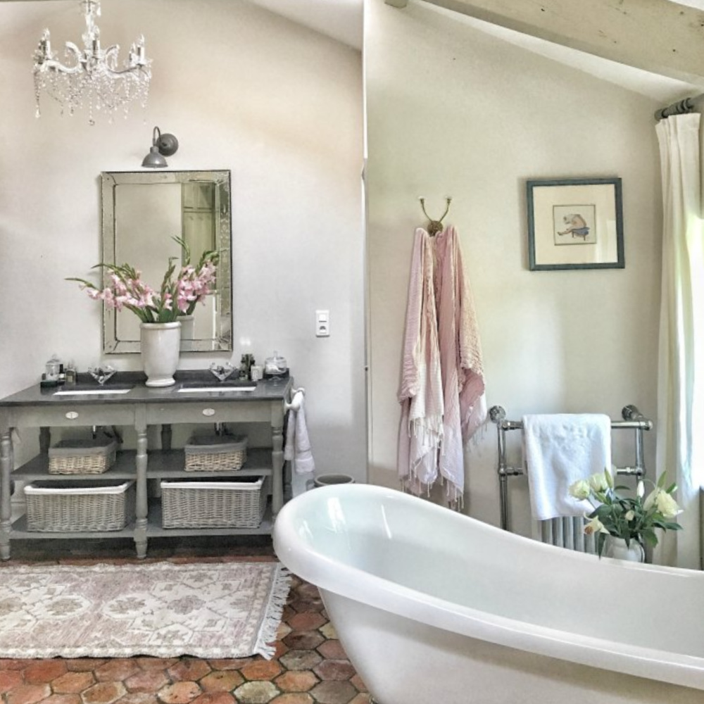 Rustic, serene, and Old World bathroom in a country house near Bordeaux, France. #bathroomdesign #oldworldstyle #frenchfarmhouse #interiordesign