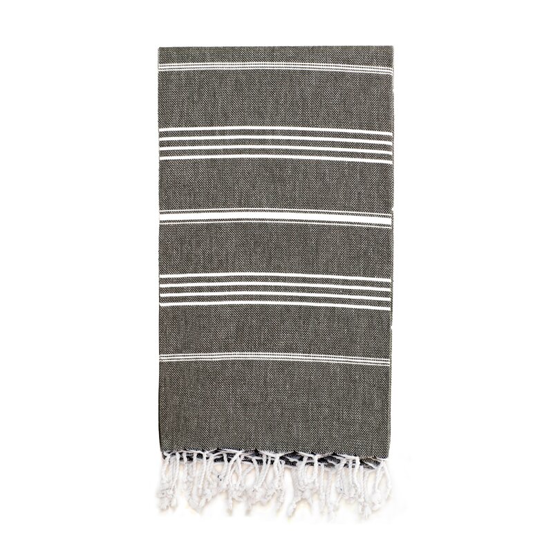 This faded black stripe Turkish cotton towel with fringe can be used so many different ways! As a beach towel, in the bath, on the table, or as a throw. #turkishtowels #rusticdecor #homedecor #bathtowels #beachtowels #blackandwhite #stripetowels