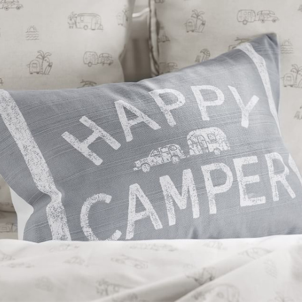 Happy Camper pillow. Airstream at Pottery Barn is a lovely collection of whimsical and happy camper decor whether we have a vintage camper to put in or not! #airstream #potterybarn #happycamper #whimsicalgifts #vintagecamper #homedecor