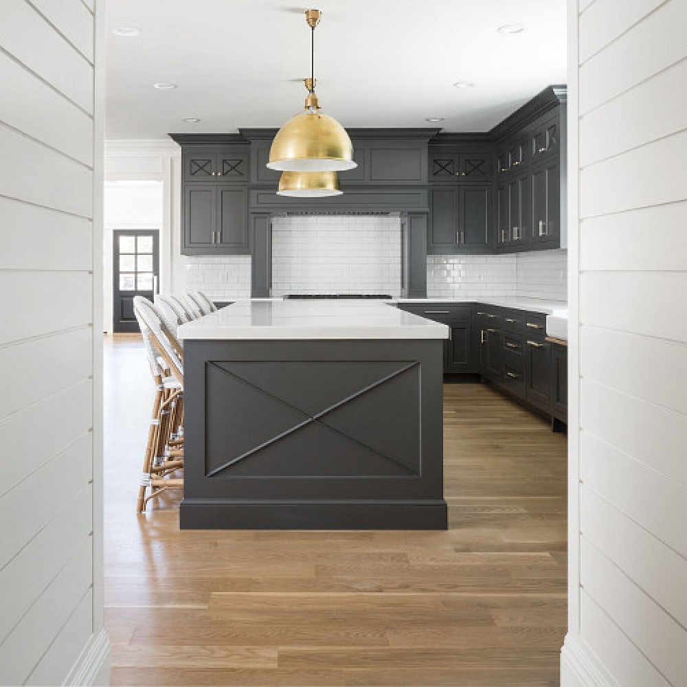 Benjamin Moore Simply White paint color on shiplap in a modern farmhouse kitchen by The Fox Group. #shiplap #benjaminmooresiimplywhite #brasspendants #thefoxgroup #kitchendesign