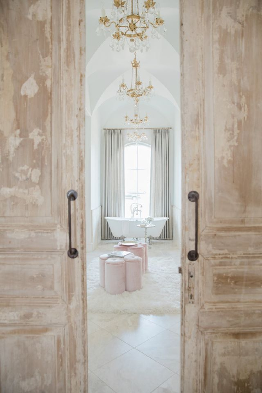 Antiqued barn doors to luxurious bath in a French country new build in Texas - Brit Jones.
