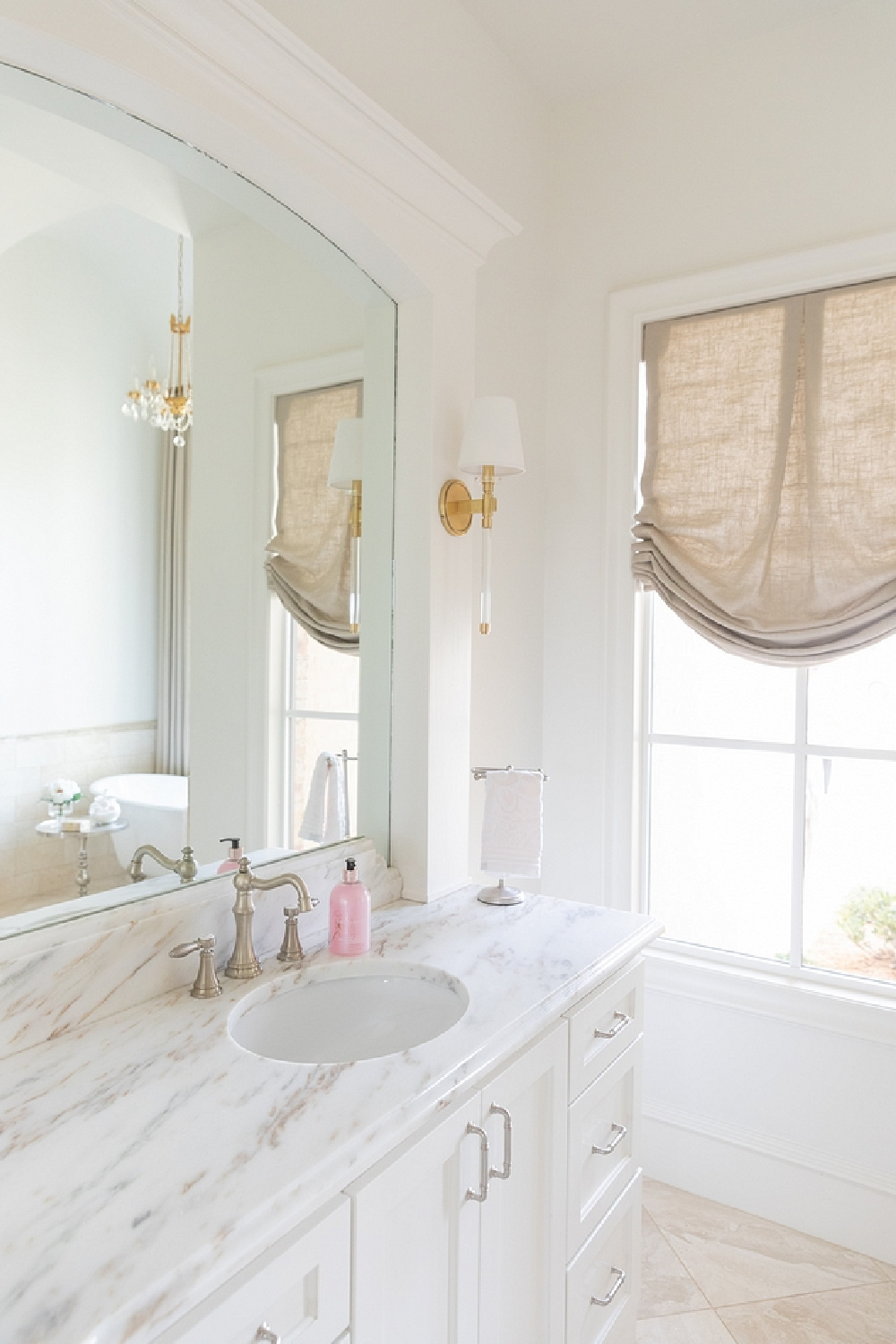 French country bathroom with white marble and roman shade - Brit Jones.