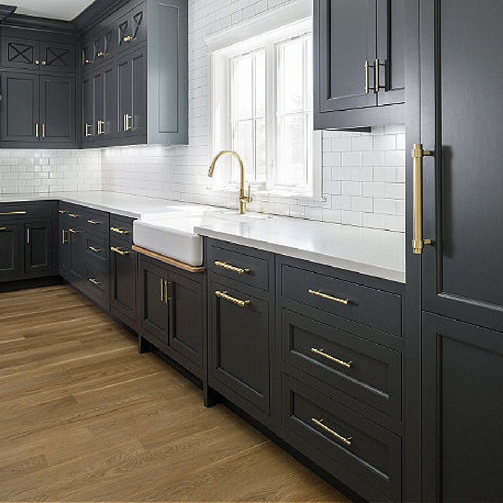 Dark charcoal grey painted cabinets in a classic kitchen by The Fox Group. Come BE INSPIRED by more Timeless Interior Design Ideas, Paint Colors & Furniture Finds! #kitchendesign #thefoxgroup #graycabinets #benjaminmoorecheatingheart #modernfarmhousekitchen