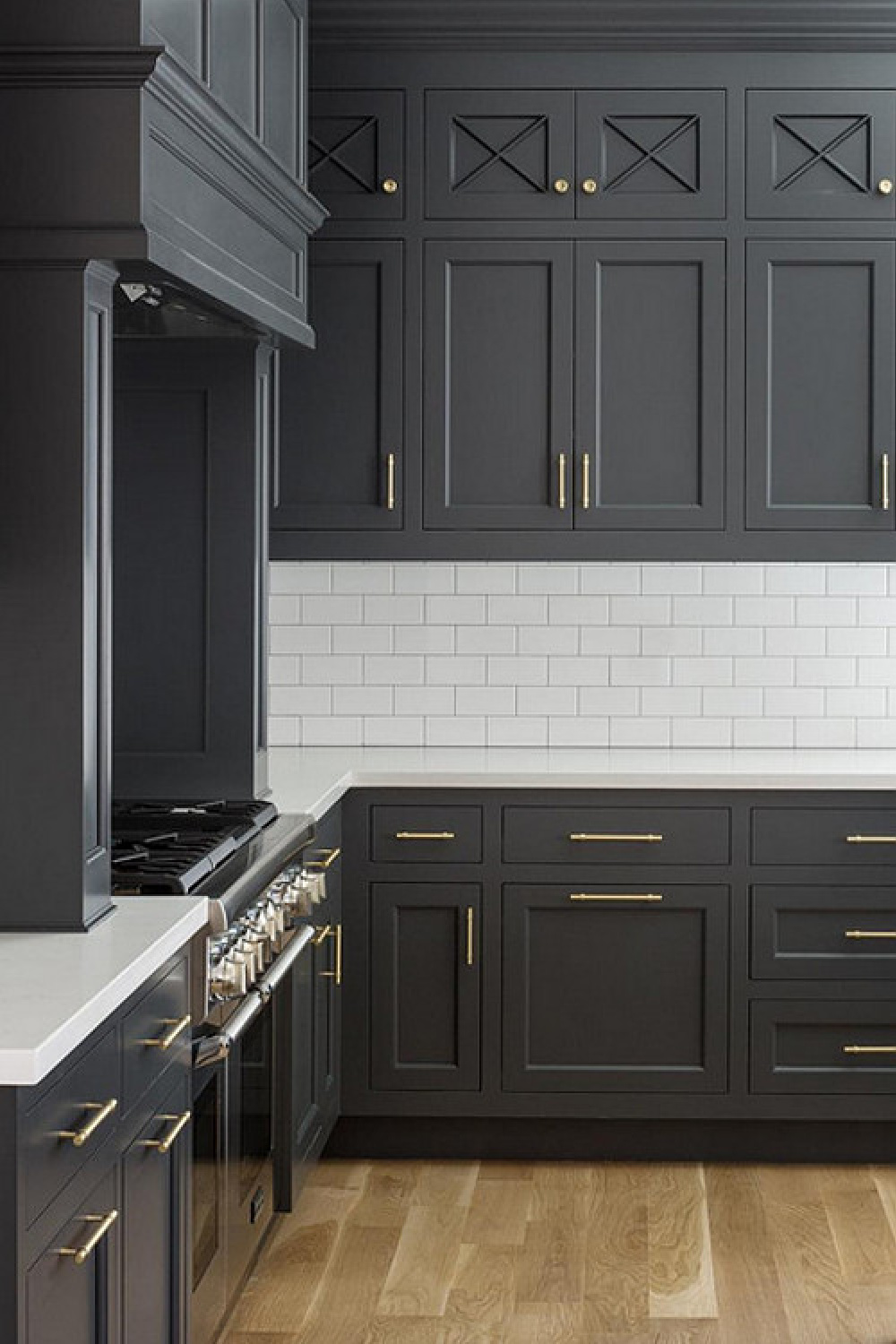 Grey and white classic timeless kitchen by The Fox Group. Come be inspired by more Timeless Interior Design Ideas, Paint Colors & Furniture. #thefoxgroup #benjaminmoorecheatingheart #kitchendesign #greycabinets #subwaytile #greyandwhitekitchen