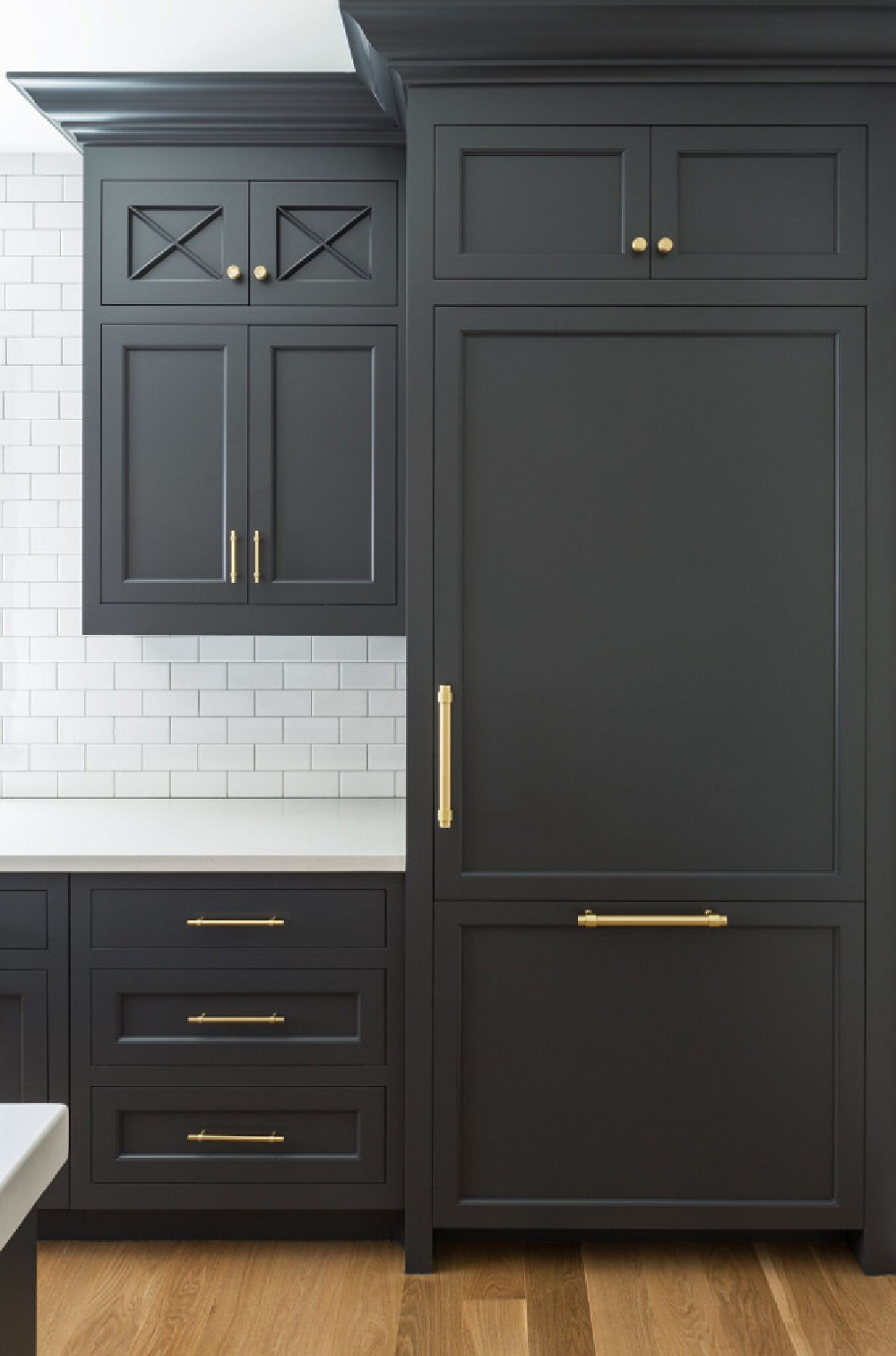 Cheating Heart (Benjamin Moore) dark gray paint color on kitchen cabinets in traditional kitchen by The Fox Group. Come be inspired by more Timeless Interior Design Ideas, Paint Colors & Furniture.  #benjaminmoorecheatingheart #kitchendesign