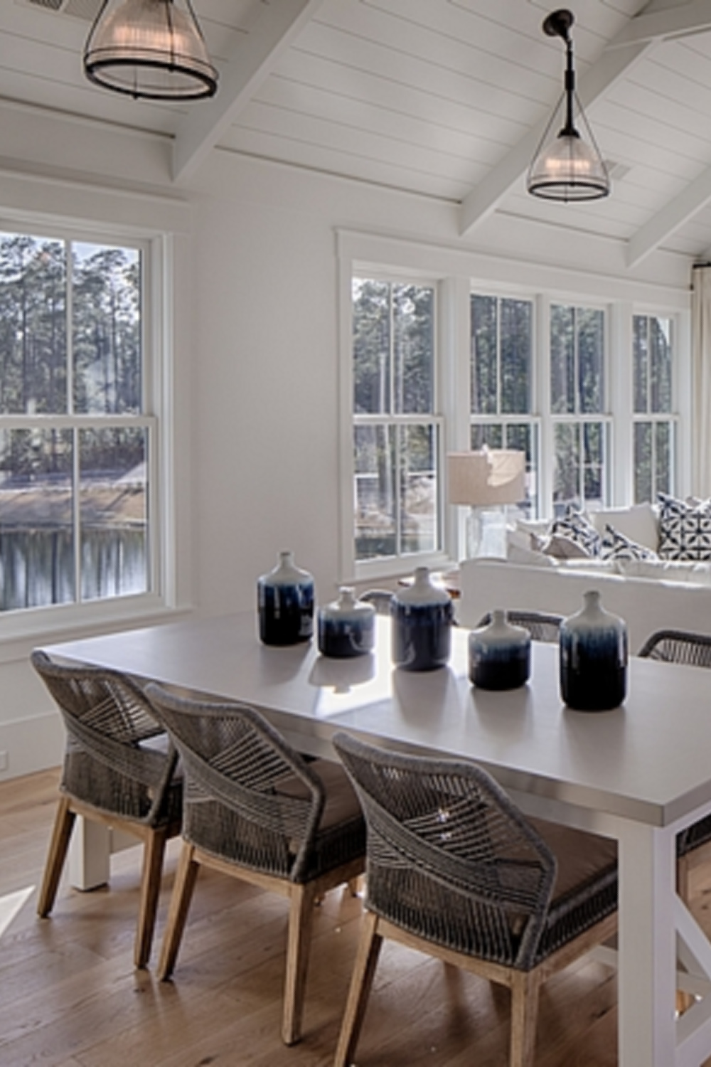 Shiplap on walls and ceilings of a great room in a board and batten coastal cottage by Lisa Furey. #shiplap #greatroom #interiordesign #coastalstyle #modernfarmhouse #benjaminmoorewhite