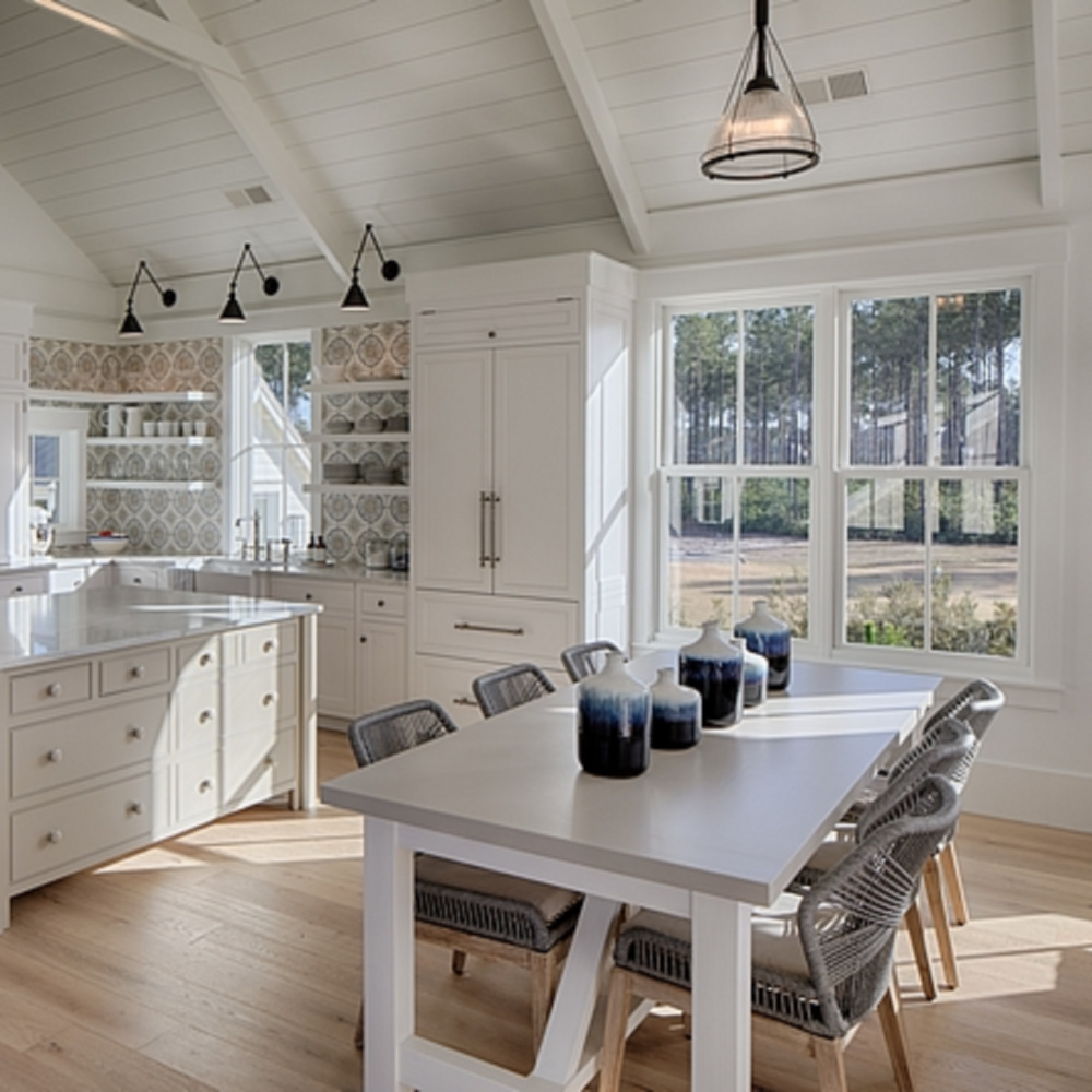 White coastal kitchen with modern farmhouse and Shaker designer elements. Lisa Furey created a welcoming home with shiplap, nods to coastal design, and blue accents. #coastalkitchen #modernfarmhousekitchen #kitchendesign #shiplap #shakerkitchen