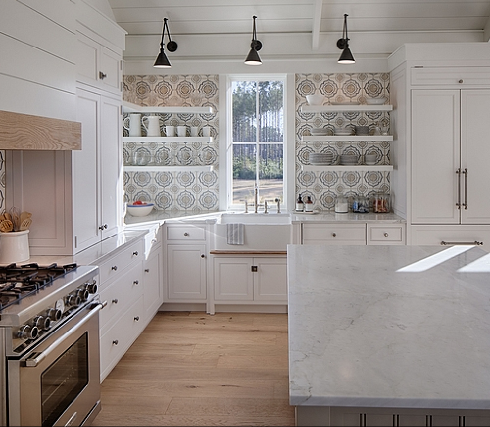 BM White OC-151 in a coastal kitchen with modern farmhouse and Shaker designer elements. Lisa Furey created a welcoming home with shiplap, nods to coastal design, and blue accents. #coastalkitchen #modernfarmhousekitchen #kitchendesign #shiplap #shakerkitchen
