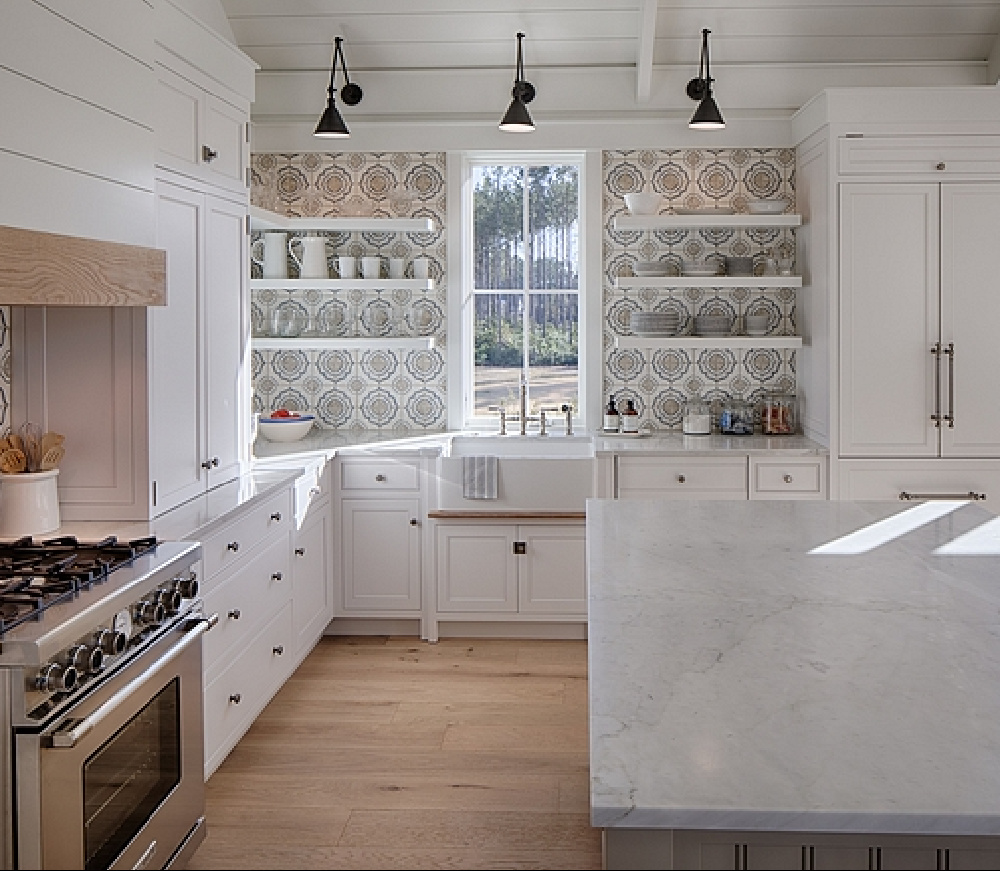 White coastal kitchen with modern farmhouse and Shaker designer elements. Lisa Furey created a welcoming home with shiplap, nods to coastal design, and blue accents. #coastalkitchen #modernfarmhousekitchen #kitchendesign #shiplap #shakerkitchen