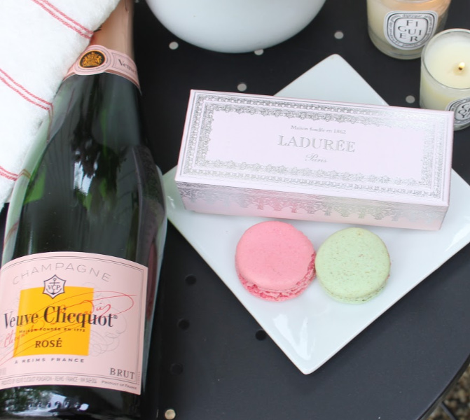 Parisian bliss on a tabletop with Veuve Cliquot pink champagne, Laduree macarons, and linen. #hellolovelystudio #Parisianstyle #veuvecliquot #pinkchampagne #laduree #macarons #pinkbox