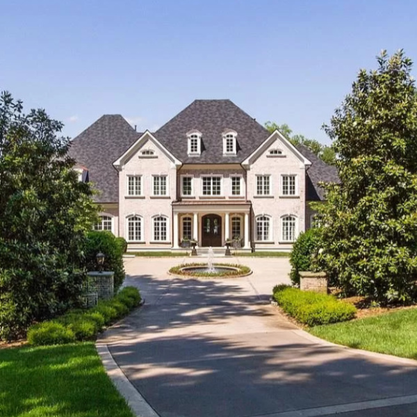 This French chateau exterior is the home of Kelly Clarkson in Hendersonville, TN. #kellyclarkson #chateau #houseexterior #mansion #houseexteriors #celebrityhome