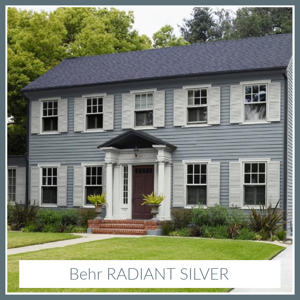 Radiant Silver Behr paint color on a traditional 2-story house exterior with white shutters. #radiantsilver #paintcolors #behrradiantsilver