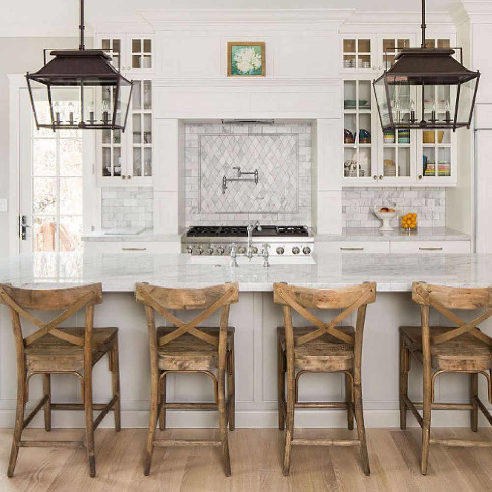 Timeless design in a luxurious kitchen by The Fox Group. Large rustic farmhouse lanterns over island. Timeless Interior Design Ideas, Paint Colors & Furniture Finds! #kitchendesign #farmhouselantern #timelessdesign #thefoxgroup #lanterns