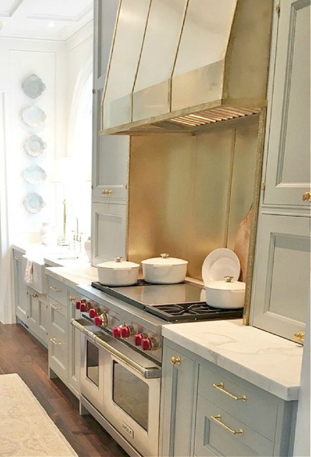 Farrow & Ball Light Blue painted cabinetry in a timeless traditional kitchen in the Southeastern Farrow & Ball Light Blue paint color on cabinets in kitchen. Southeastern Designer Showhouse 2017. #farrowandballlightblue #kitchendesign #bespoke #lightbluepaint #brasshardware