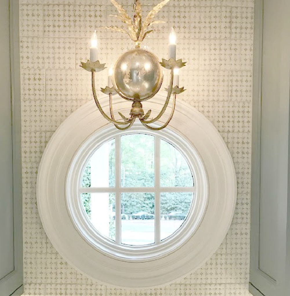 Round window and tile backsplash in blue and white traditional kitchen in Southeastern Designer Showhouse 2017. #kitchendesign #roundwindow #tilebacksplash #traditionalstyle