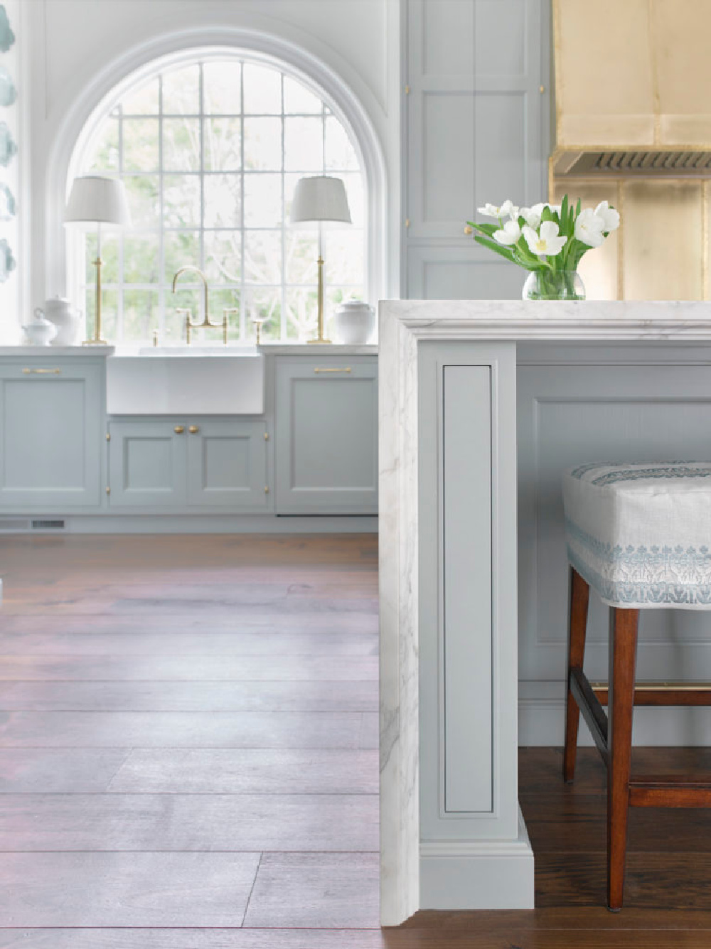 Breathtaking kitchen with light blue by Matthew Quinn. The sink wall with arched window is a shining moment amidst countless others! 