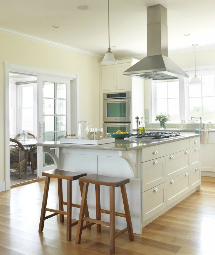 Lovely wide plank birch hardwood flooring in a white Shaker kitchen with classic traditional design. #carlisle #flooring #wideplankfloors #hardwoodfloor #interiordesign #kitchendesign