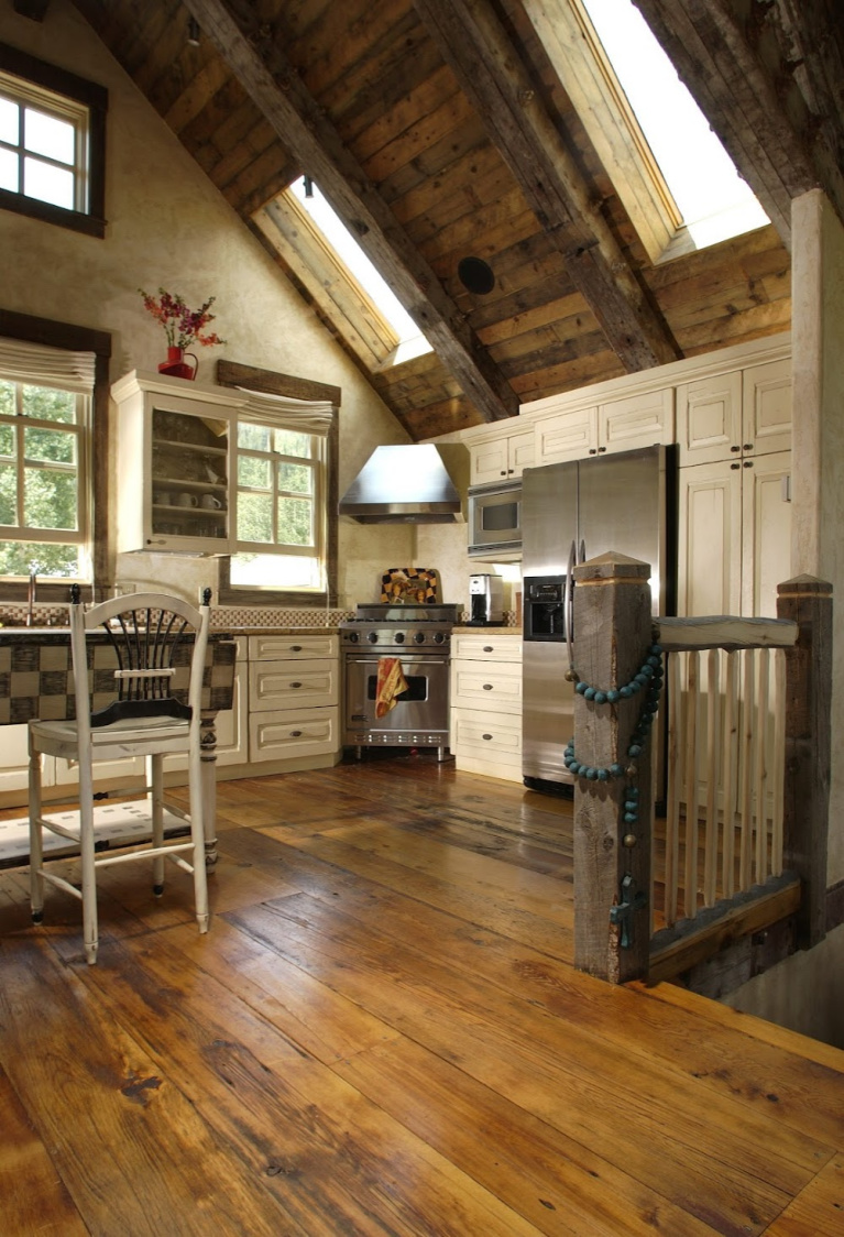 Rustic reclaimed barnwood flooring plays a starring role in this custom Colorado kitchen design. #flooring #hardwoodfloor #reclaimedfloor #barnwood #rusticfloor #carlisle #wideplankfloors #kitchendesign