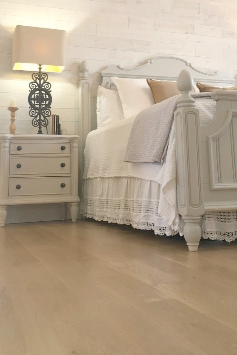 Hello Lovely Studio's French country bedroom with white oak hardwood floors and neutral palette. #hellolovelystudio #flooring #whiteoak #hardwoodfloors #frenchcountry #interiordesign #bedroomdesign