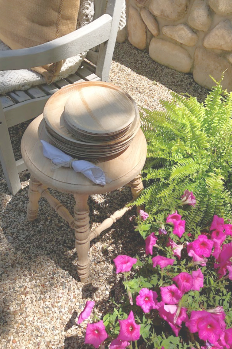 In my French country pea gravel courtyard, plates made from palm leaves look like wood and are a perfect choice for summer outdoor entertaining. I used them as mini individual cheese boards and dessert boards - Hello Lovely Studio. #easyentertaining #palmplates #disposableplates #tabledecor #summerentertaining