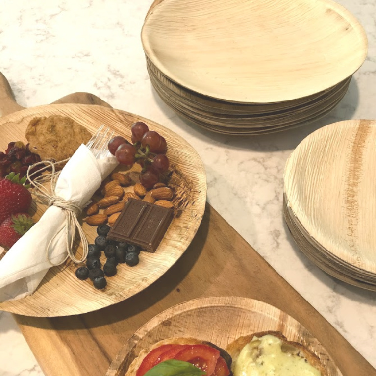 These disposable plates made from palm leaves look like wood and are a perfect choice for summer outdoor entertaining. I used them as mini individual cheese boards and dessert boards - Hello Lovely Studio. #easyentertaining #palmplates #disposableplates #tabledecor #summerentertaining