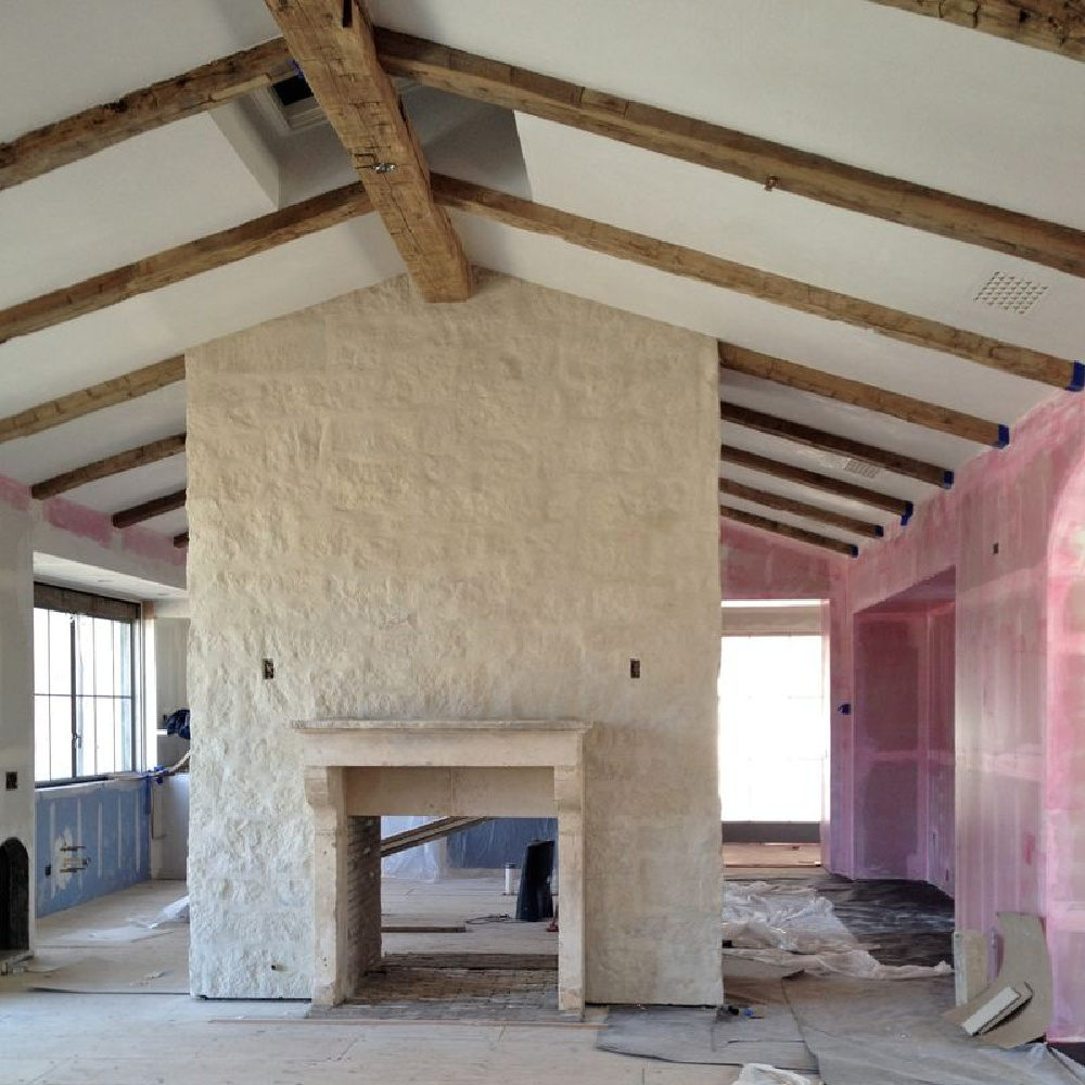 Limestone fireplace under construction at Patina Farm - Brooke Giannetti & Steve Giannetti. #patinafarm #frenchfarmhouse #modernfarmhouse #fireplaces #limestone