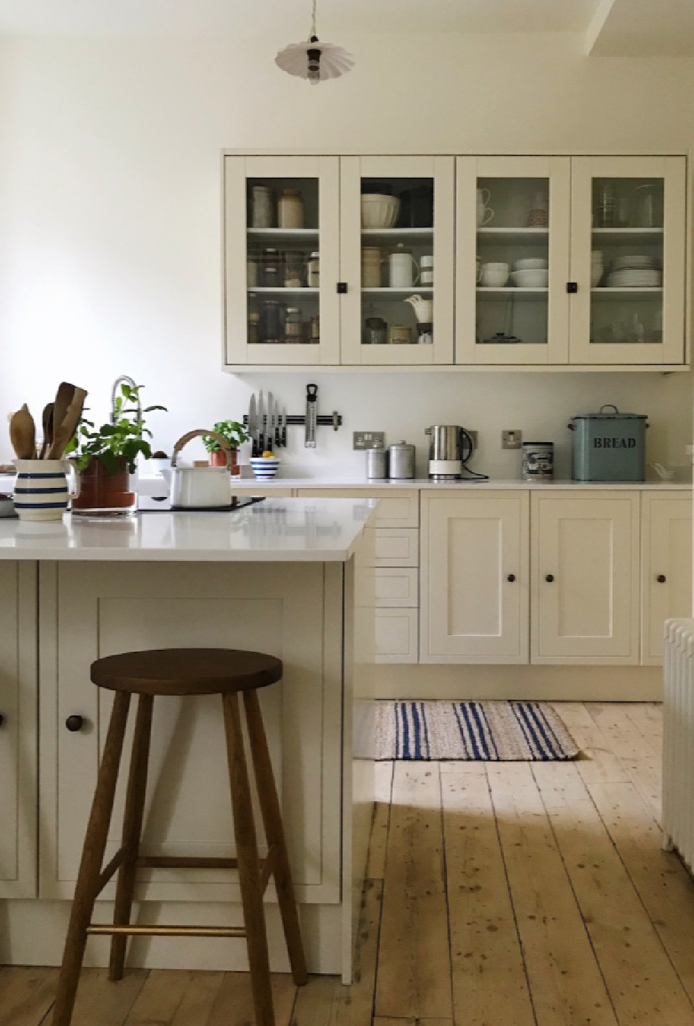 Wimborne White paint color by Farrow & Ball on walls of a glorious country kitchen by Siobhan McFadden of Homestead. #wimbornewhite #farrowandball #paintcolors #englishcountry #kitchendesign #whitepaintcolors #interiordesign