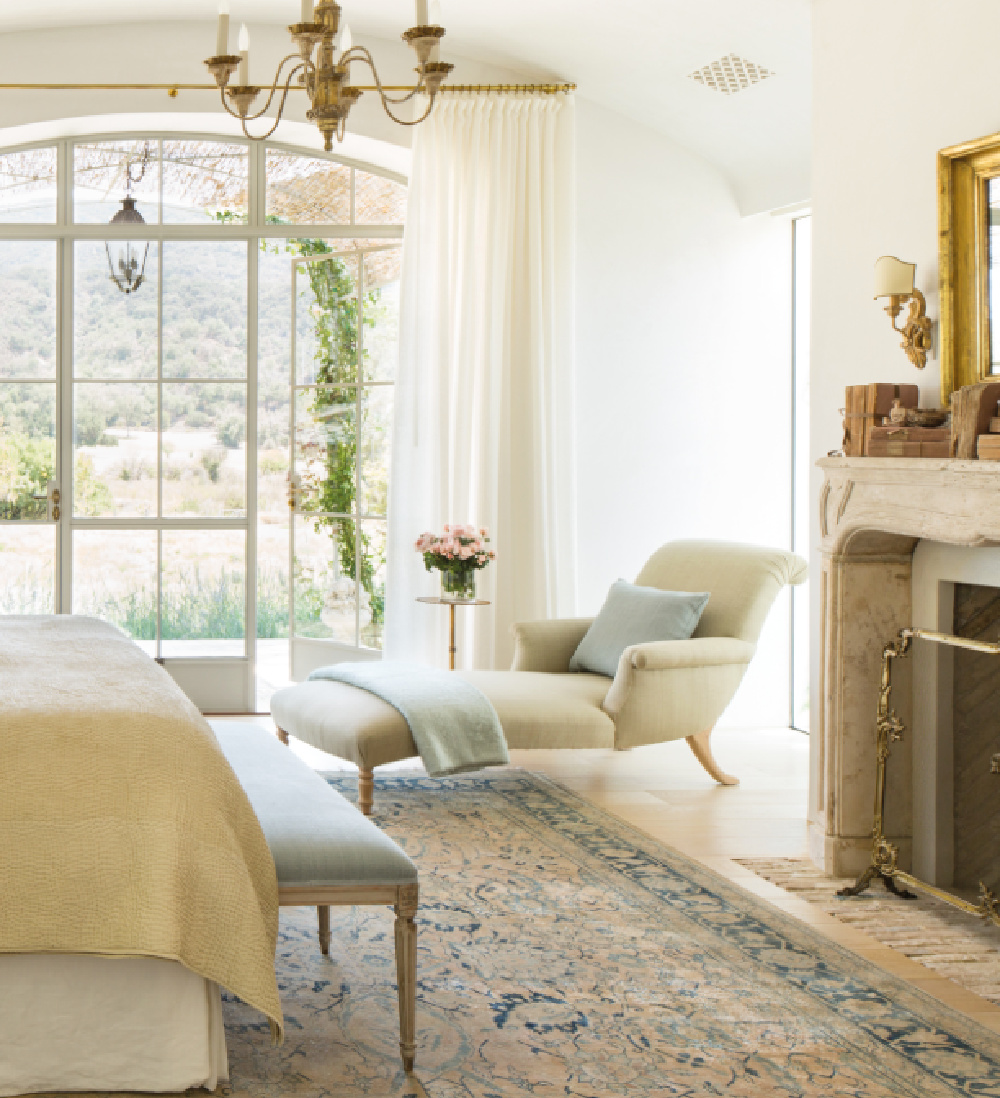 Patina Farm master bedroom by Giannetti Home is a study in European country elegance with California organic simplicity. Photo: Velvet and Linen. #patinafarm #bedroom #europeancountry #modernfarmhouse #chaise #interiordesign #bedroomdecor