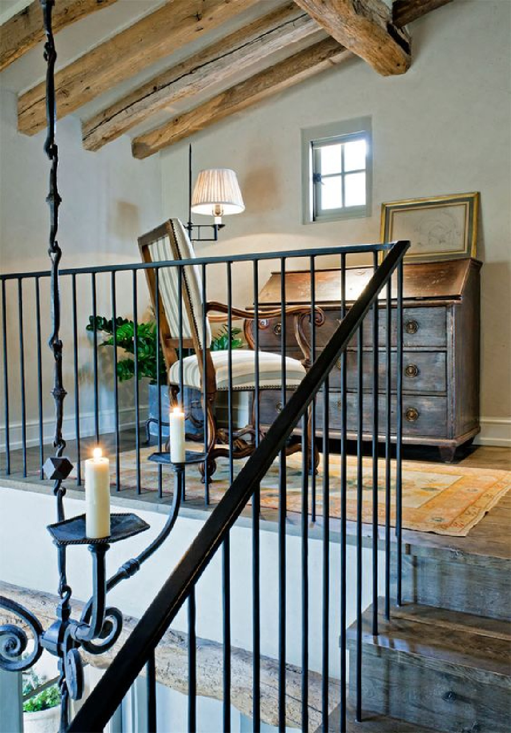 Is it a stairway to heaven? This lofty space with rustic elegance and country charm is a but one moment in this story brimming with interior design inspiration for admirers of European inspired country decor. #loft #rusticdecor