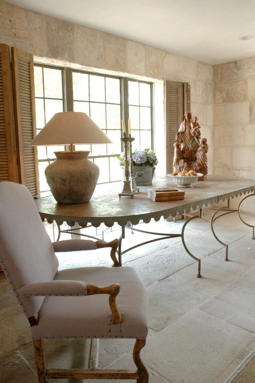 Country French romance, authenticity, and aged beauty in this interior from Chateau Domingue. #stonewalls #countryfrench #oldworldstyle