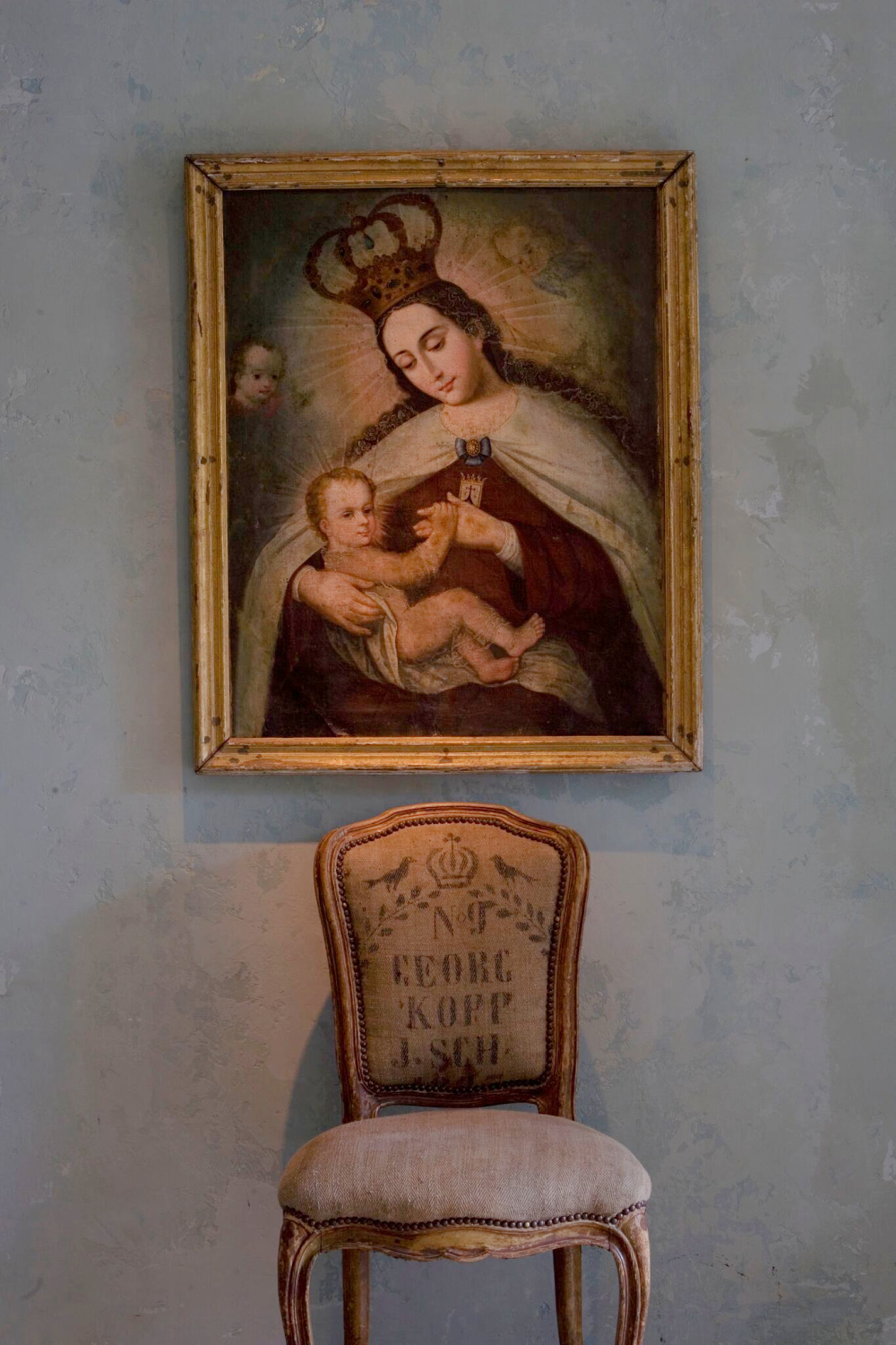 Beautiful antique religious art from France with elegant chair upholstered in gransack - Chateau Domingue.