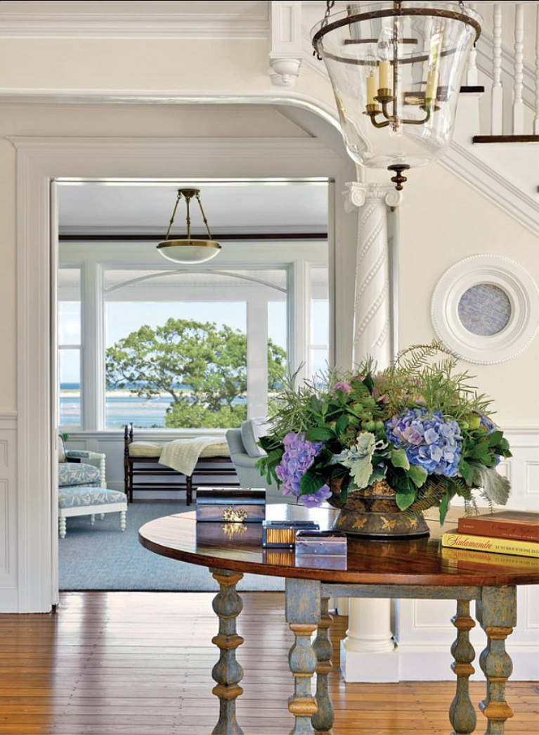 Maritime White (Benjamin Moore) paint color on the walls of a coastal style entry in a luxurious traditional home - Kotzen Interiors). #paintcolors #benjaminmooremaritimewhite #maritimewhite #interiordesign #coastalstyle #entry