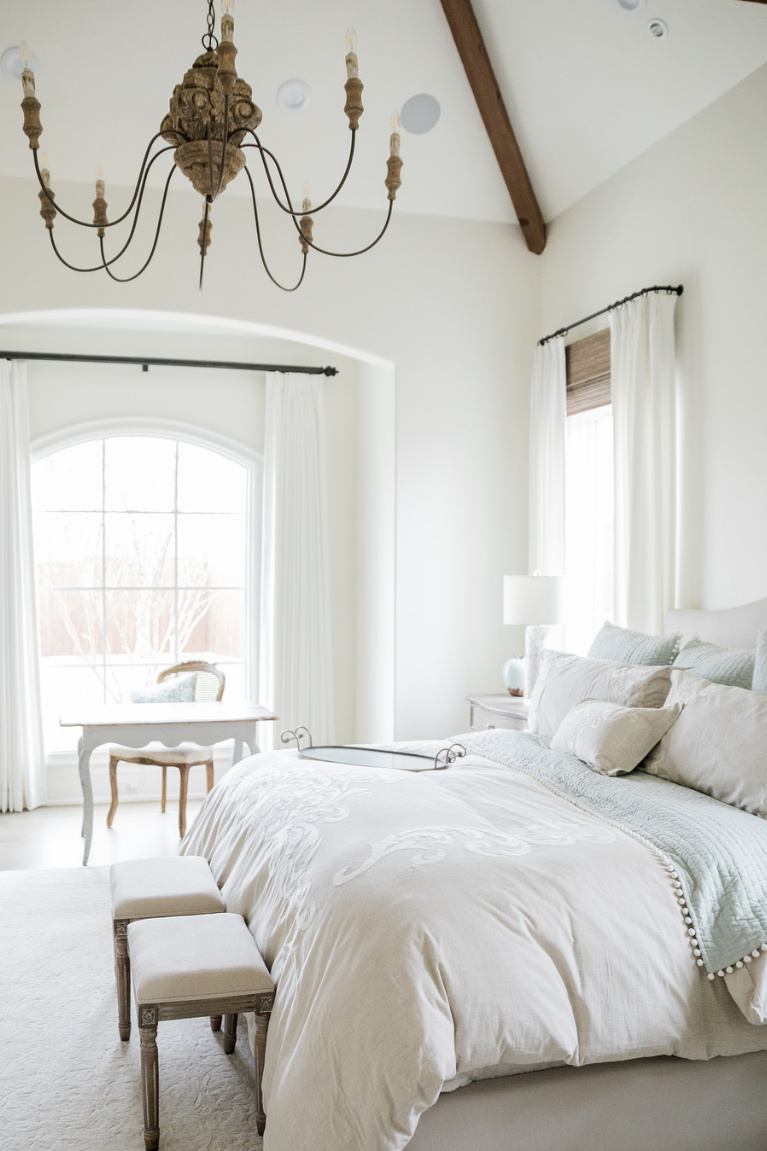 French country bedroom with Alabaster (Sherwin Williams) pain on walls. Discover inspiring understated neutrals to try in your own home. #paintcolors #sherwinwilliamsalabaster #whitepaintcolors #bestwhitepaint