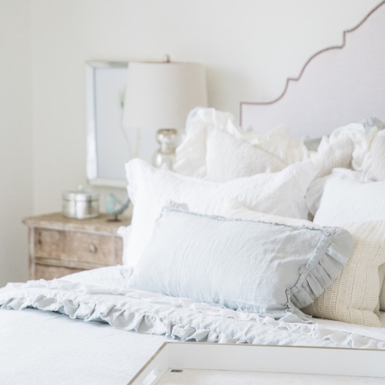 Elegant, romantic and serene French country bedroom with upholstered headboard and white drapes - Brit Jones. #interiordesign #romanticdecor #bedroomdecor #frenchcountry #whitebedrooms