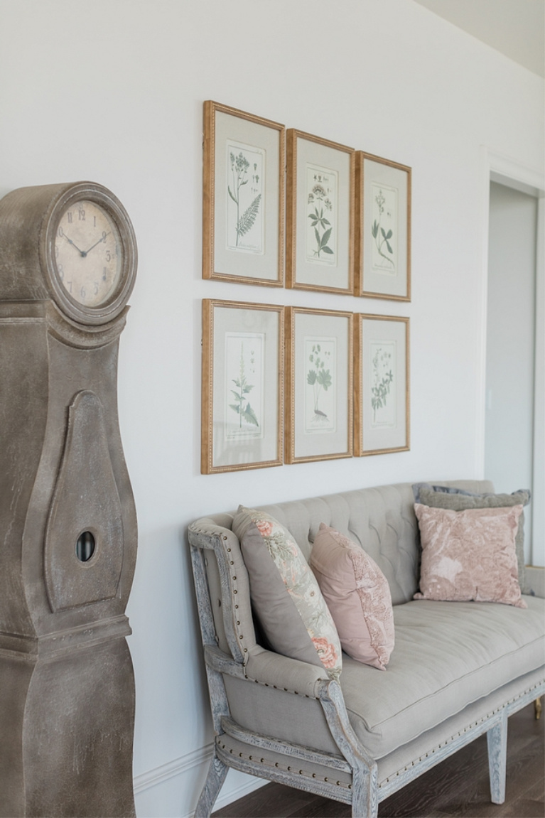 French country landing with settee, botanical prints and grandfather clock - Brit Jones. #interiordesign #frenchcountry #settee #botanicalprints #romanticdecor #oldworld