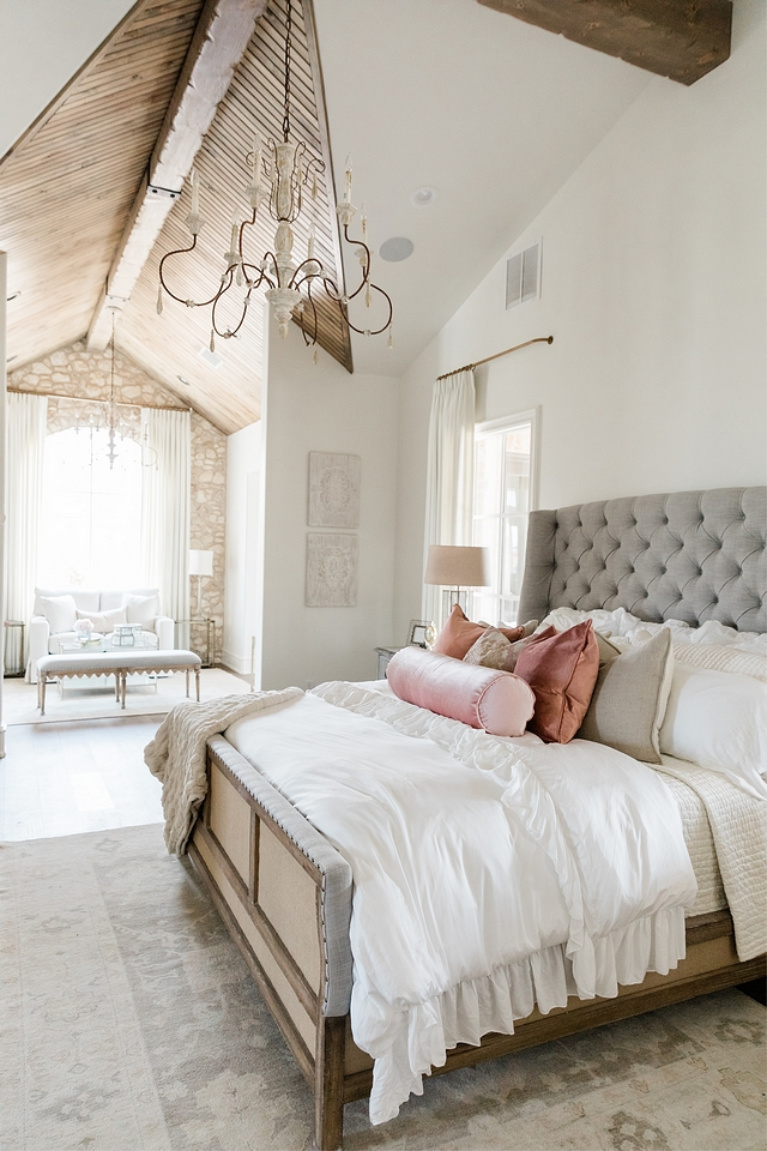 Rustic elegance in a French country bedroom with romantic decor by Brit Jones. #romanticbedrooms #interiordesign #frenchcountry #rusticdecor #barndoor #modernfrench