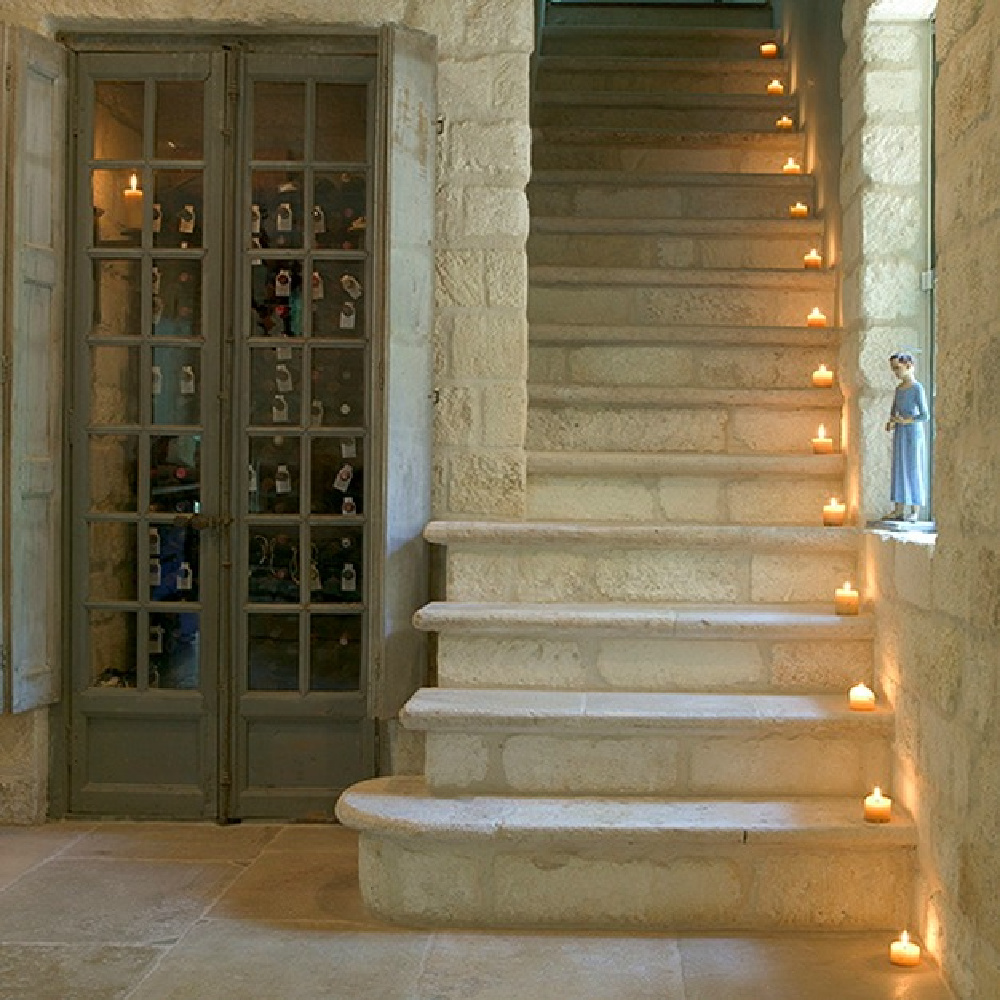 Antique French limestone staircase - Chateau Domingue Timeless European Elegance and French farmhouse style converge in this house tour of founder Ruth Gay's home on Hello Lovely. Reclaimed stone, antique doors and mantels, and one of a kind architectural elements. #housetour #frenchcountry #frenchfarmhouse #europeanfarmhouse #chateaudomingue #rusticdecor #pamelapierce #elegantdecor